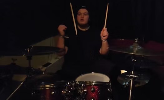 Kyle Oatley performing live on drums